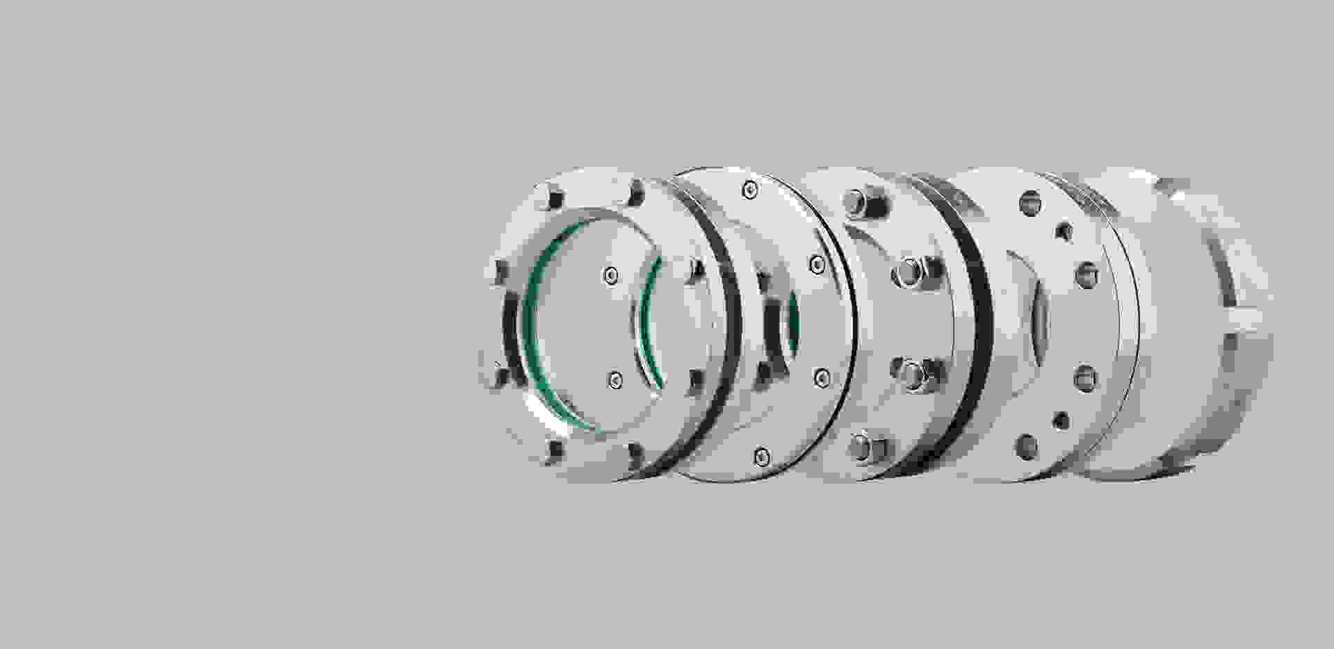 Image of several stainless steel flanges nested together.