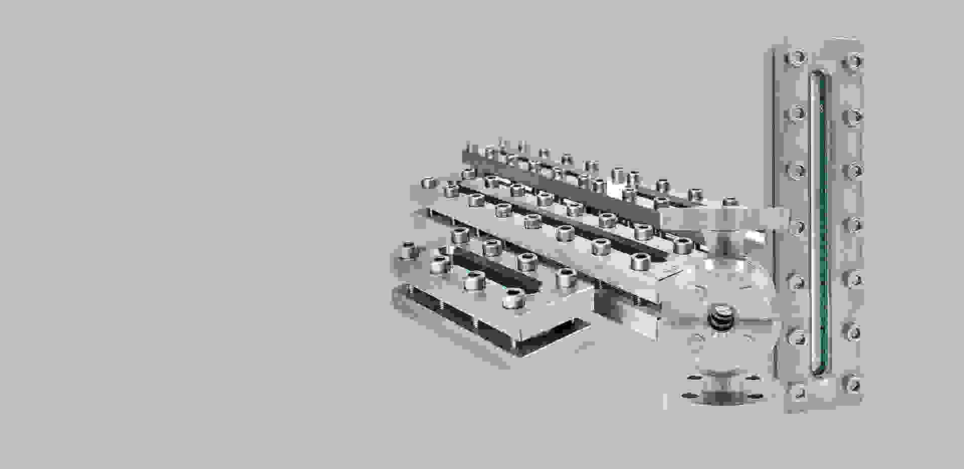 Stainless steel components, including plates, pipes, and a flange, on a gray background.