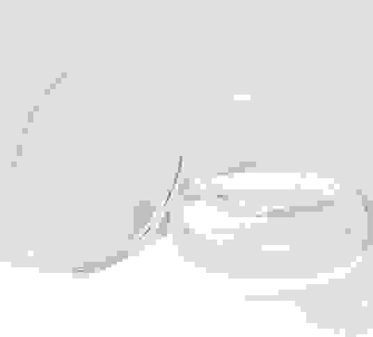 Three clear lenses in different sizes on a white background.