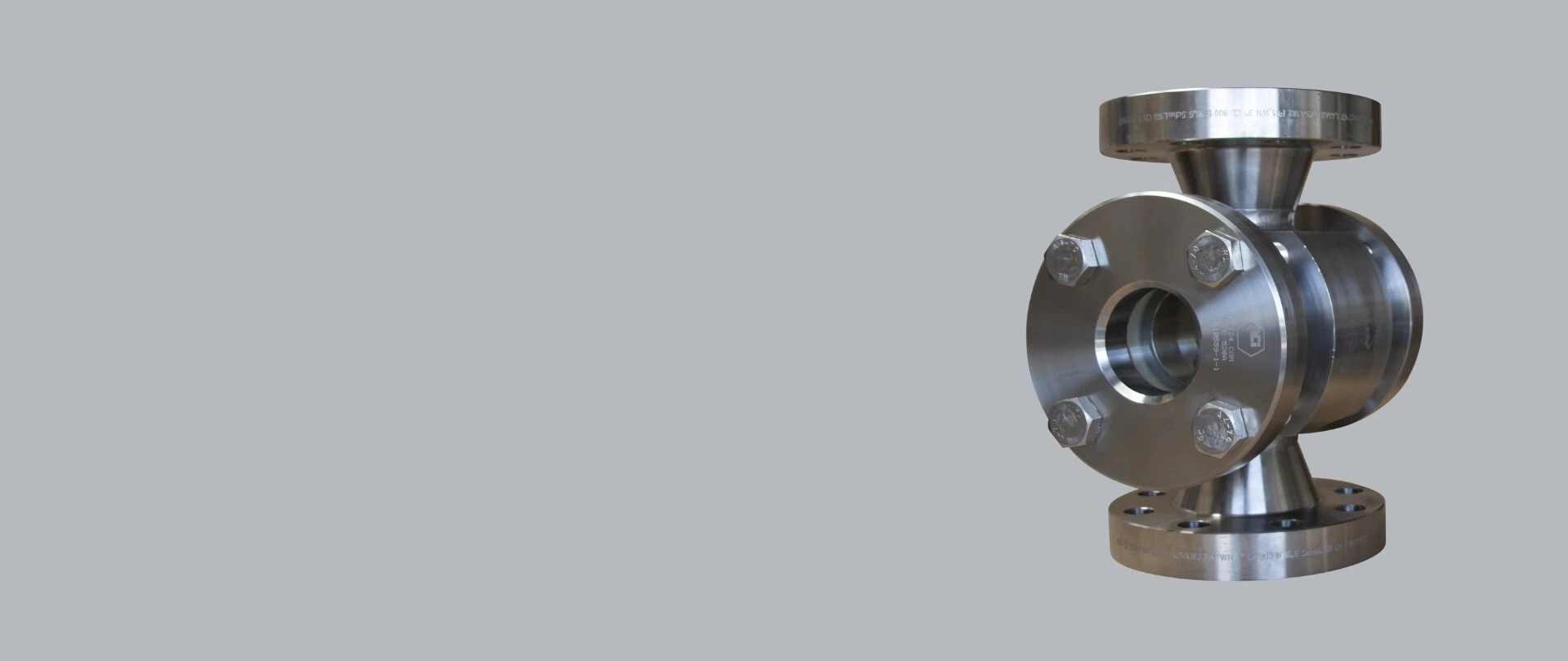 Stainless steel valve with flanges, standing on a gray background.