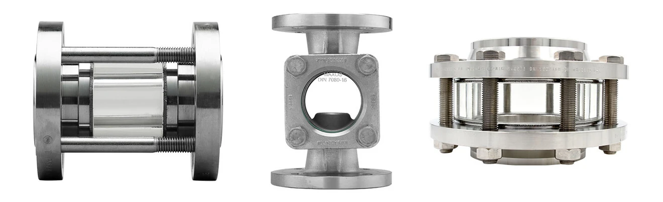 Three different sight tubes made of stainless steel with glass, for monitoring flows in pipelines.