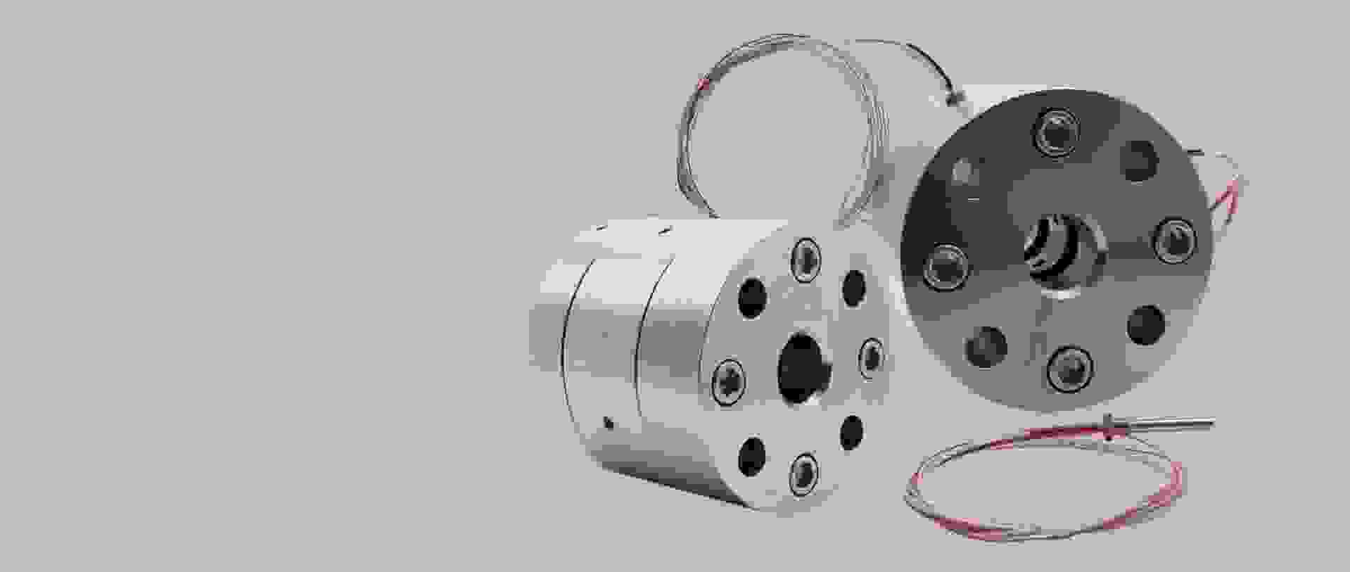 Two precision stainless steel cylinders with cables, representing technical components.