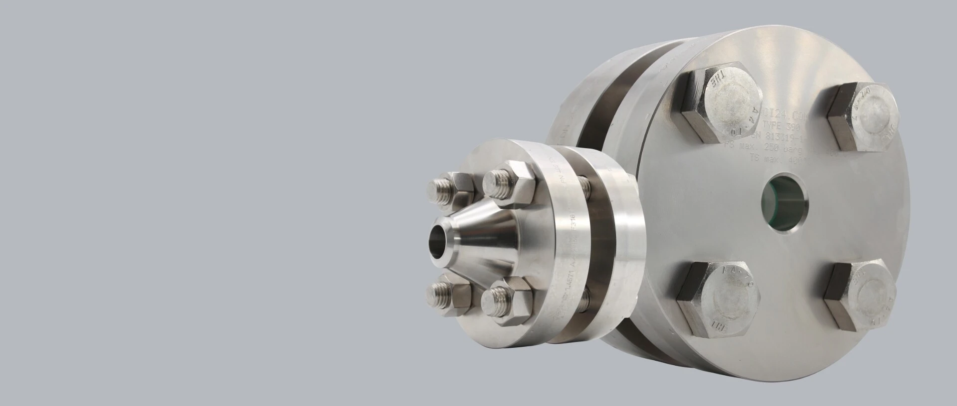 Stainless steel flange with screws and a tapered outlet. Technical construction.