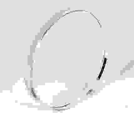 A transparent glass lens in a circular format.