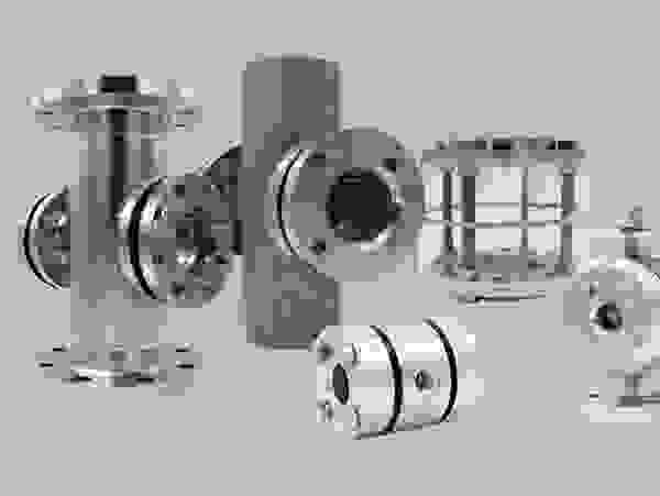 Various industrial stainless steel valves and components on a gray background.