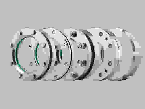 Image of several stainless steel flanges nested together.